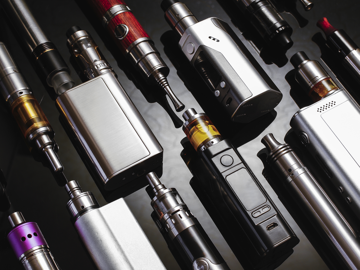 Variety of models of vaporizers against a black background.
