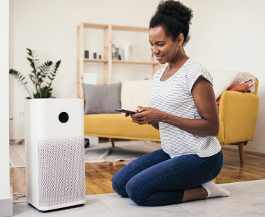 Person using an air cleaner
