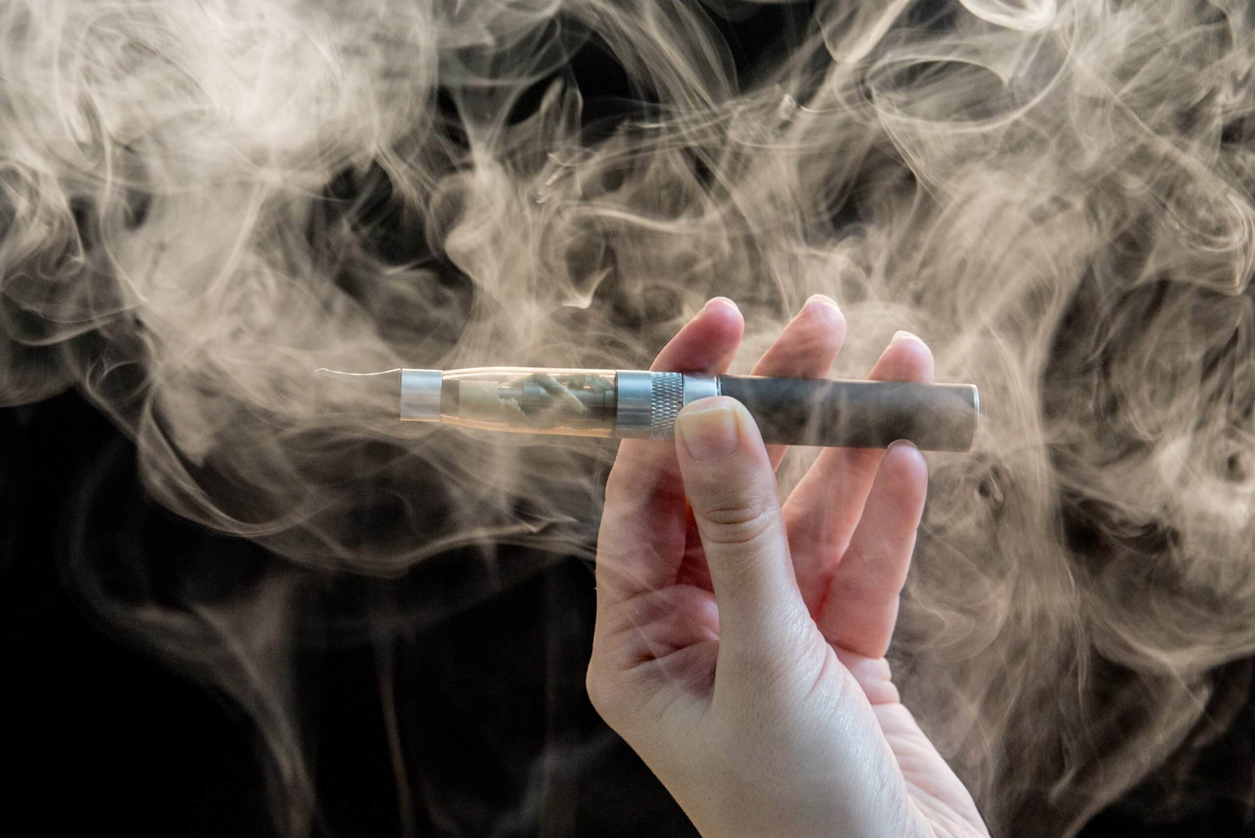 Electronic nicotine delivery system in a person's hand.