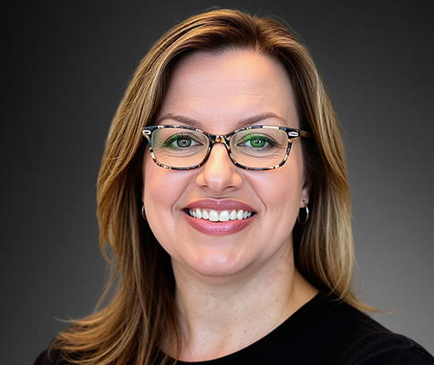 Rey Grimes, senior events specialist, poses for her professional headshot.