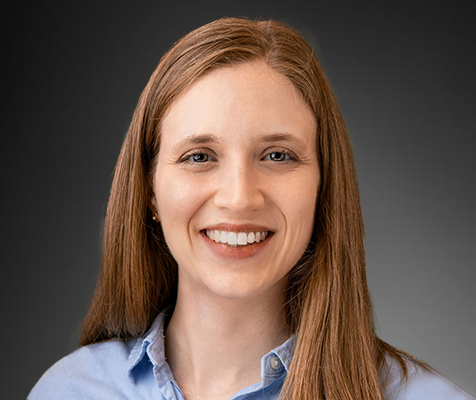 Sarah Connelly, Ph.D., education and outreach manager, poses for a professional headshot.