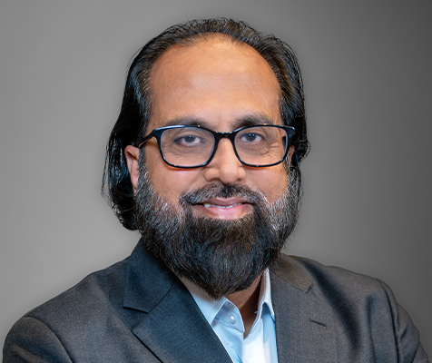 Asif Rashid, M.S., senior manager of software development and data integration, poses for his professional headshot.