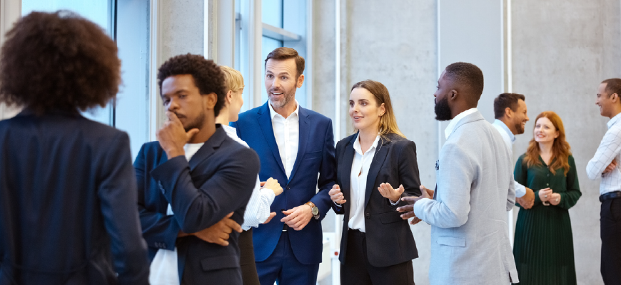 Professionals networking at a conference.