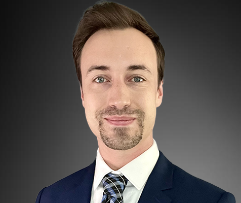 Taylor Wall, M.Sc., a smiling senior toxicology and exposure data scientist, poses for his professional headshot.