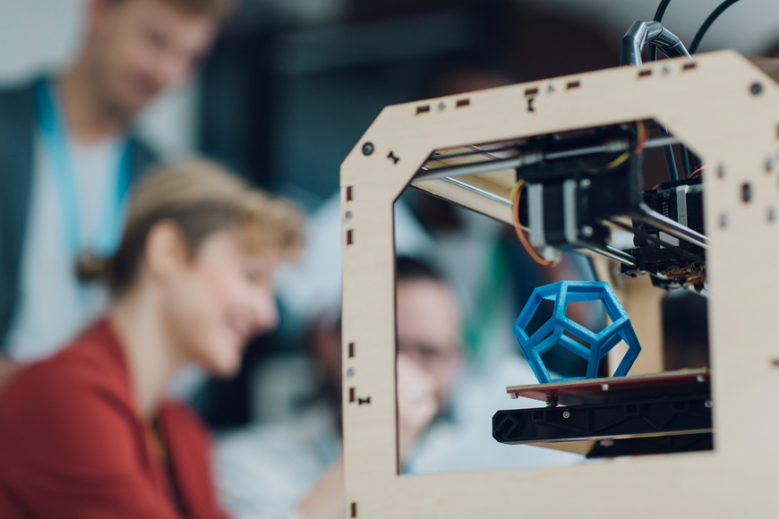 Creative Start-Up Business Team Working by 3D Printer.