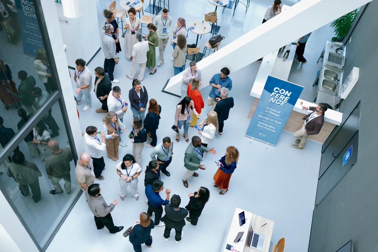 High-angle image showing real human interaction at scale. Suitable for themes like innovation, community, workplace culture, and collaboration.