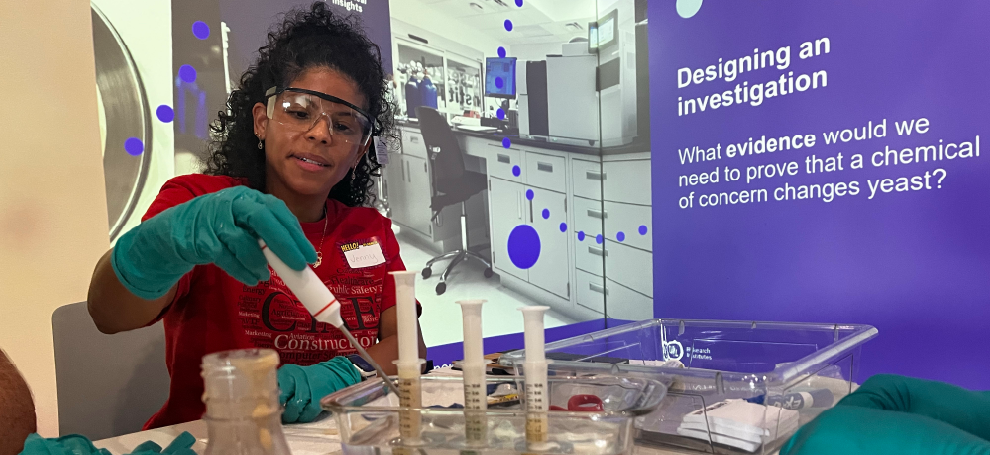 A teacher participates in a yeast investigation.